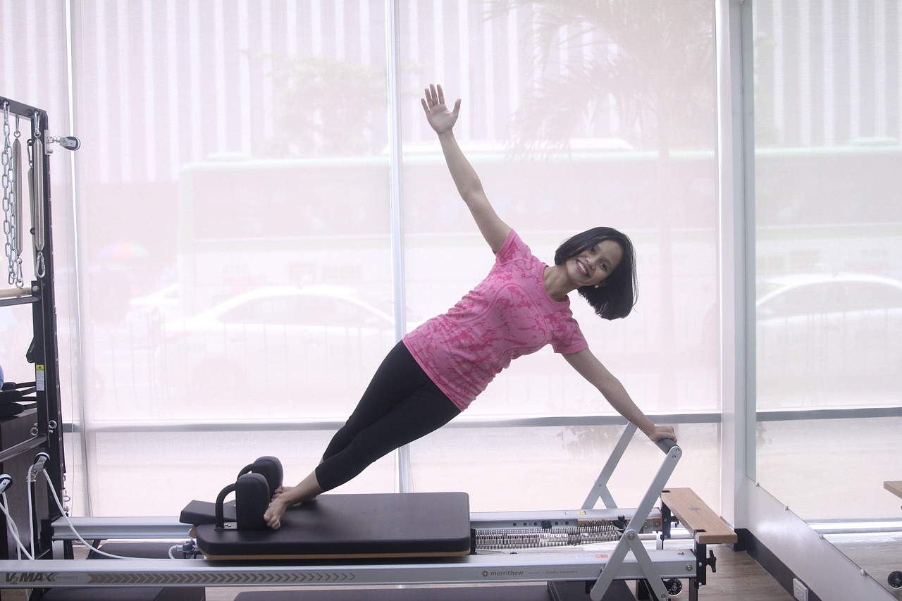 woman using a pilates reformer